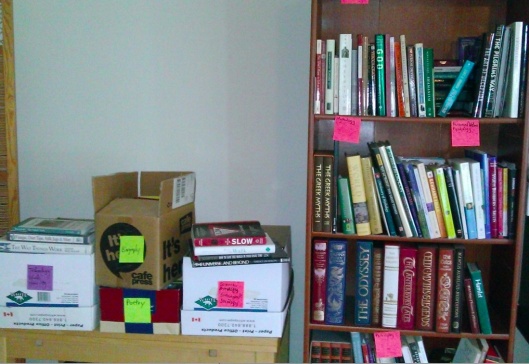 books on bookcase and in boxes