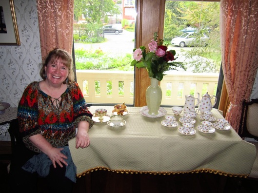 Blonde Lady sitting at tea table in Emily Carr house